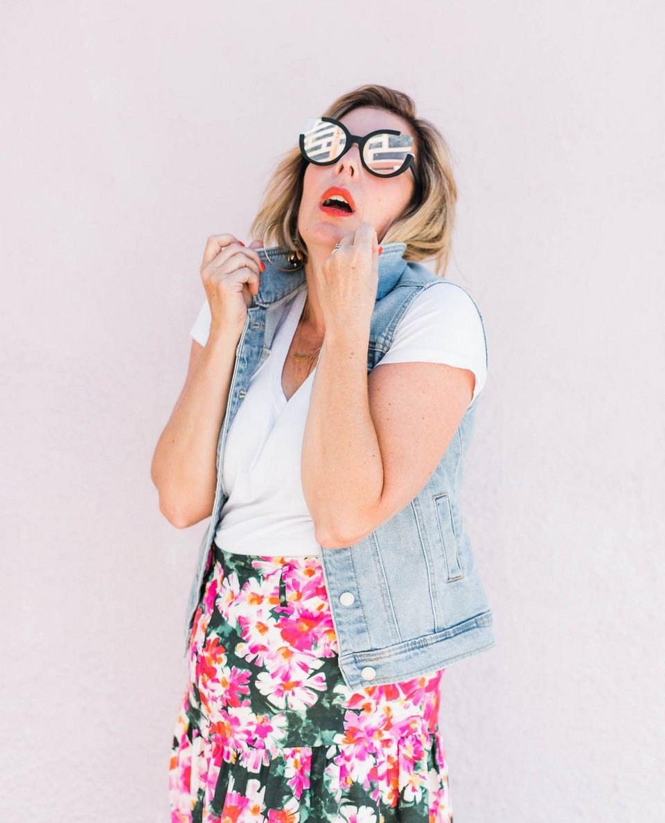 Kara in a denim vest and joke glasses, mock-shocked